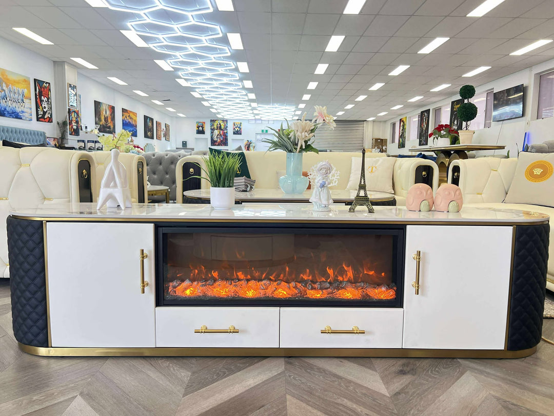 Modern living room setup with a white entertainment console featuring an electric fireplace.