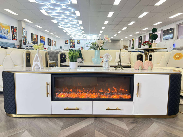 Modern living room setup with a white entertainment console featuring an electric fireplace.