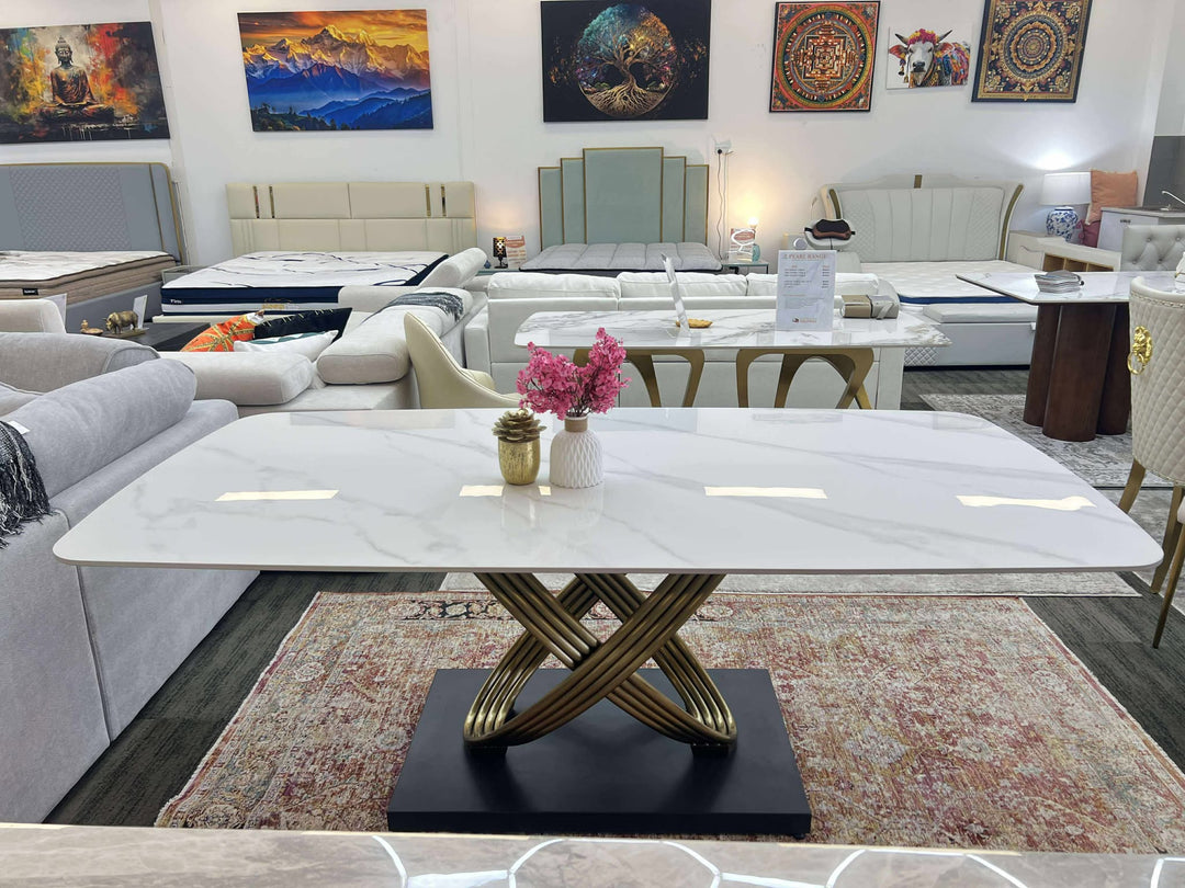 Modern living room with a marble coffee table and decorative elements.