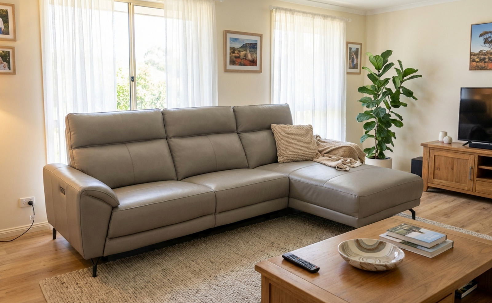 Living room with a beige sectional sofa, wooden coffee table, and decorative elements.
